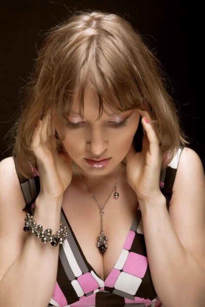 Young woman on black background