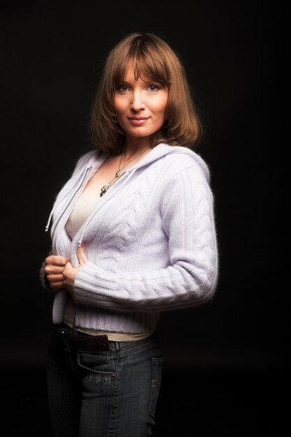 Young woman on black background