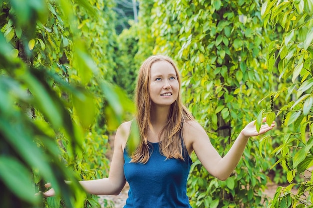 Young woman on a black pepper farm in Vietnam, Phu Quoc