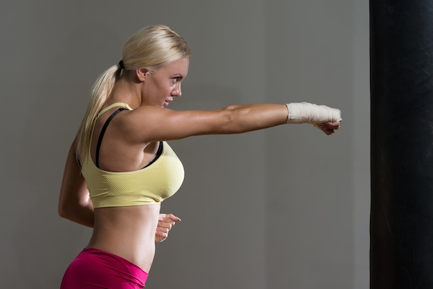 Young Woman Boxer MMA Fighter Practice Her Skills