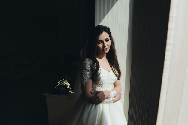 young woman bride trying on wedding dress at modern wedding,Happy and smiling