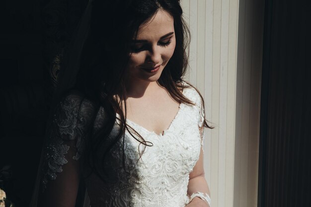 young woman bride trying on wedding dress at modern wedding,Happy and smiling