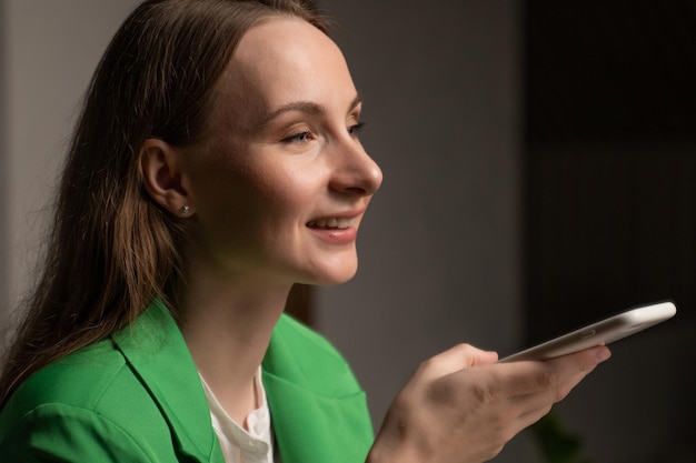 Young woman calls to friend telling about first working day