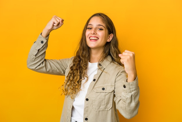 Young woman cheering carefree and excited