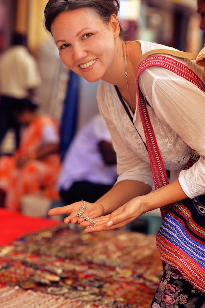 Young woman choosing jewelry