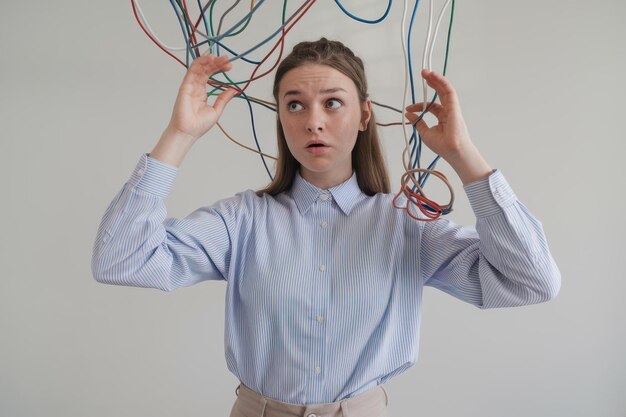 Photo young woman colorful wires representing workplace stress visualizing modern work challenges stress