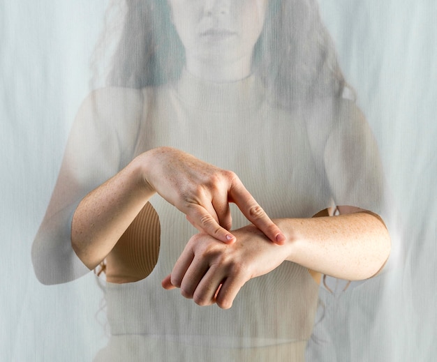 Young woman communicating through sign language