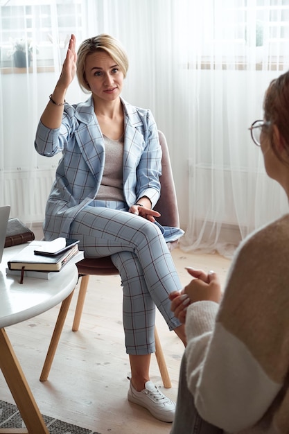 Young woman at a consultation with a psychologist mental health care