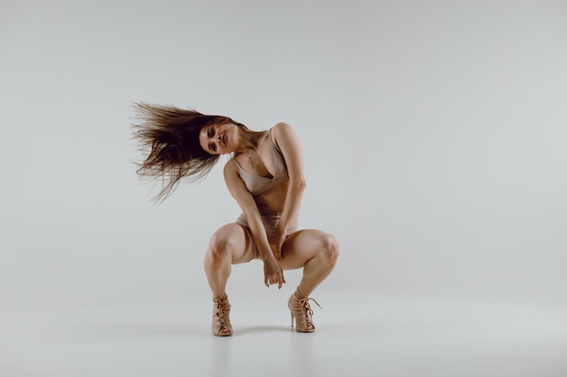 Young woman dancer dancing high heels dance