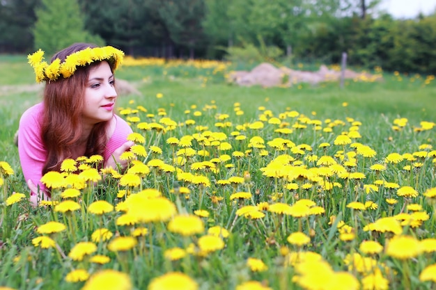 young woman on dandelion meadow