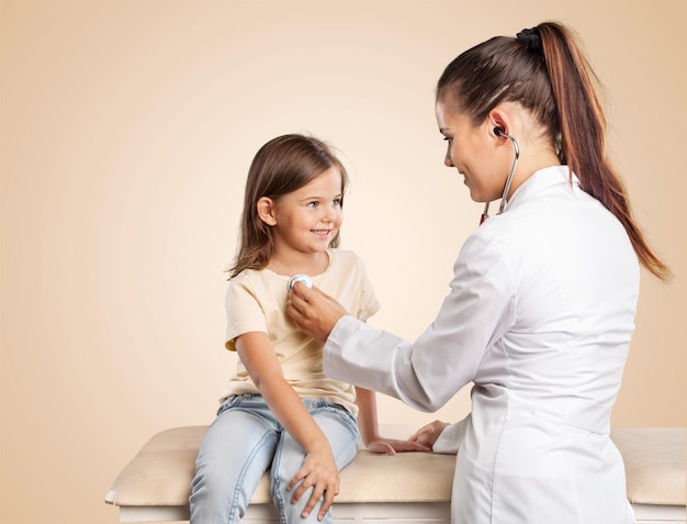 Young woman doctor with little girl