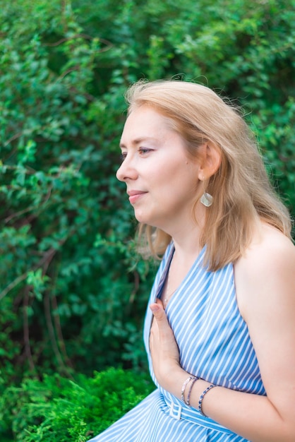 A young woman dreams in the park