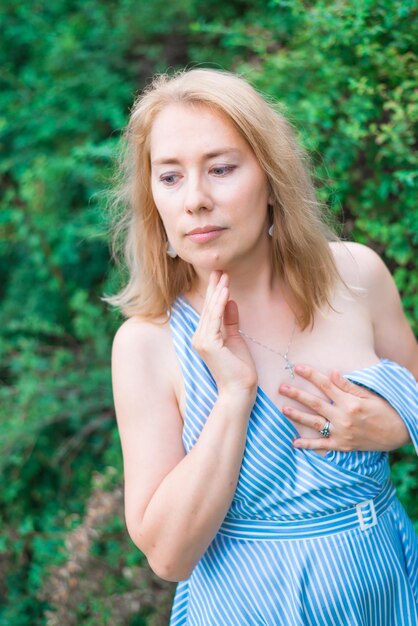 A young woman dreams in the park