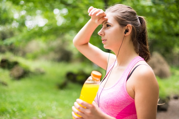 Young woman drinking after sport