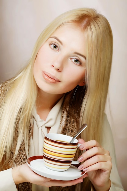 Young woman drinking coffee