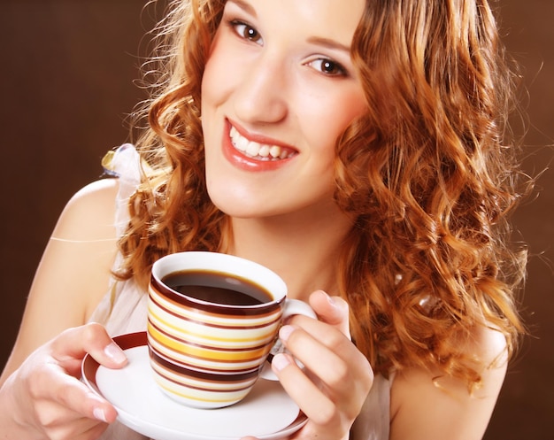 Young woman drinking coffee