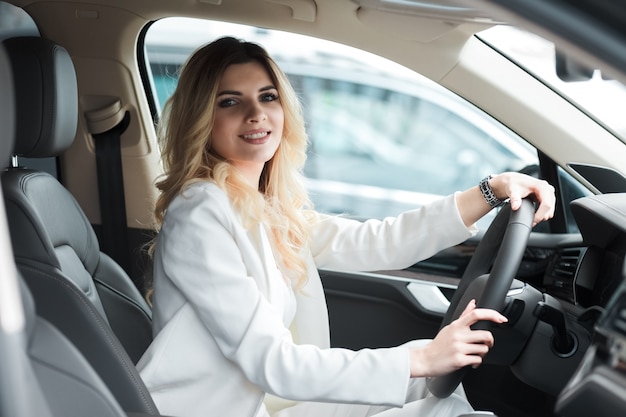 Young woman driving a car.