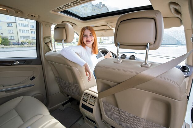 Young woman driving her car