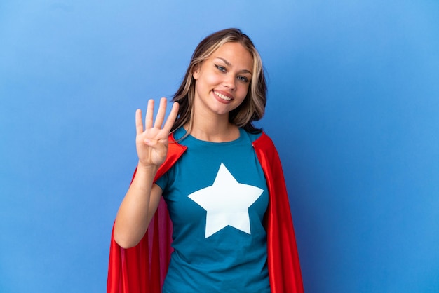 Young woman in dungarees over isolated yellow background sending a message with the mobile