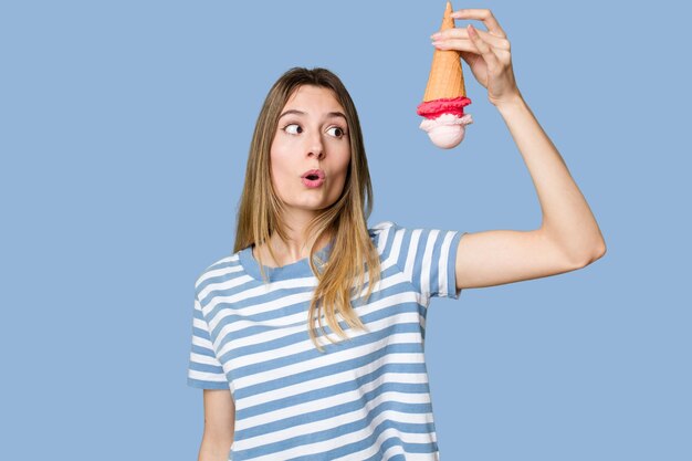 Young woman eating an ice cream isolated