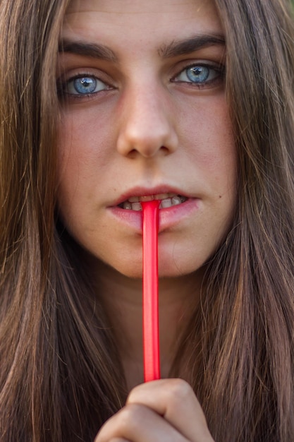 Young woman eating liquorice