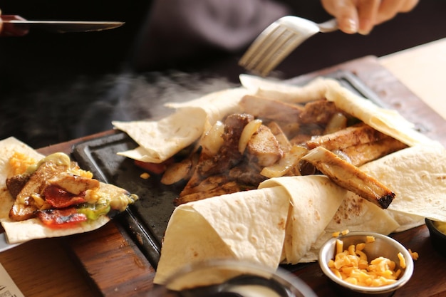 A young woman eats a tasty fresh Indian meals