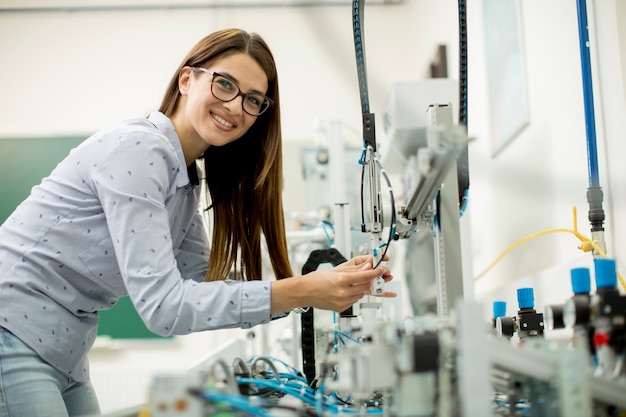 Young woman in electronic workshop