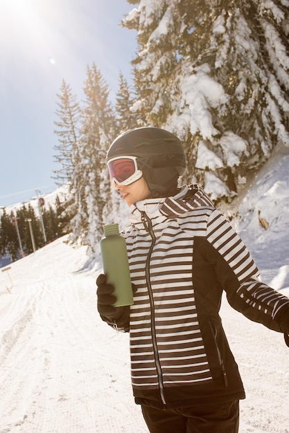 Young woman enjoing winter day of skiing fun in the snow