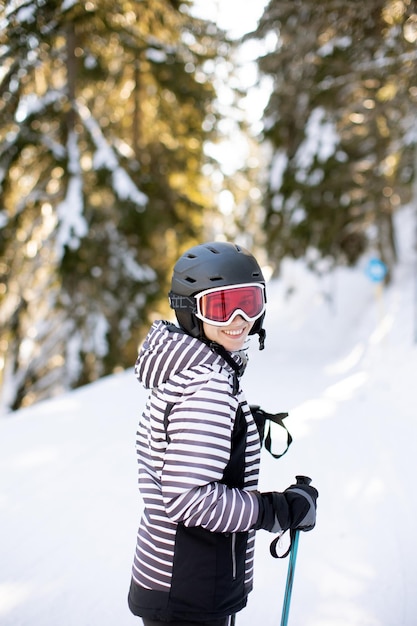 Young woman enjoing winter day of skiing fun in the snow