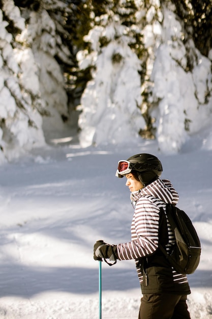 Young woman enjoing winter day of skiing fun in the snow