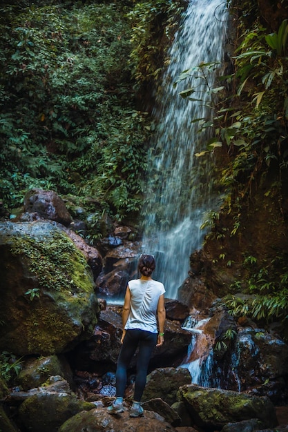 A young woman enjoying the Cascada del Cerro Azul Meambar National Park