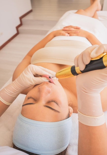 Young Woman Enjoying a Day at the Spa. Performing different treatments for the care of your skin and face.