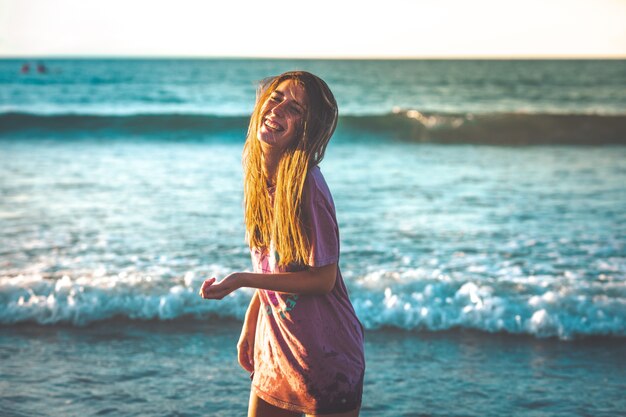 Young woman enjoying a lot at the beach of Zarautz.