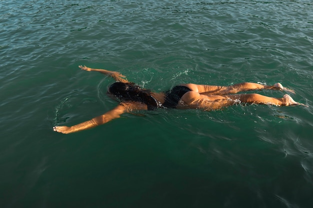 Young woman enjoying swimming