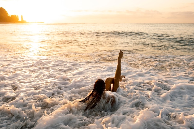 Young woman enjoying time on the beach