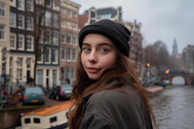 Photo young woman enjoying a trip to amsterdam in winter