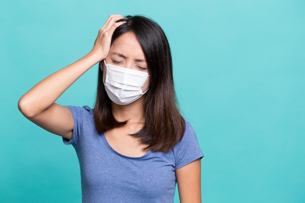 Young Woman feeling sick and wearing face mask