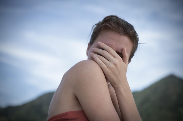 Young woman filled with regret with hand on face feeling anxiety nerves depressed lonely depressed