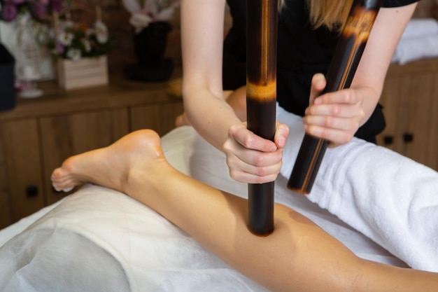 Young woman getting a back massage in a spa salon Beauty treatment concept