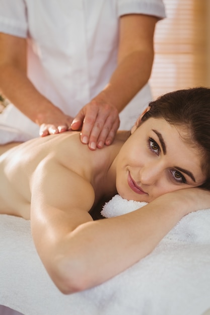 Young woman getting shoulder massage