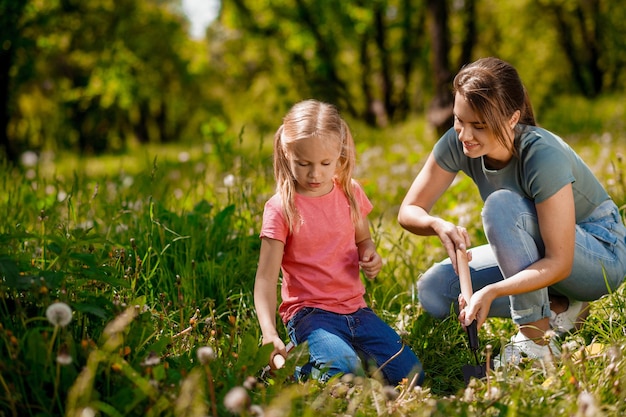 Young woman and a girl looking busy with gardening