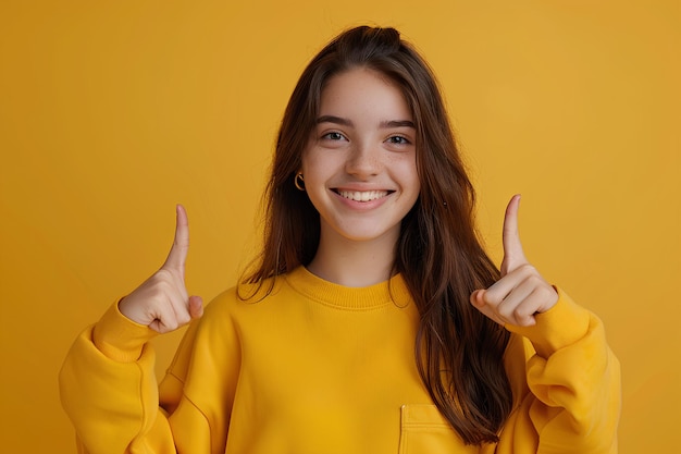 A young woman giving the thumbs up sign