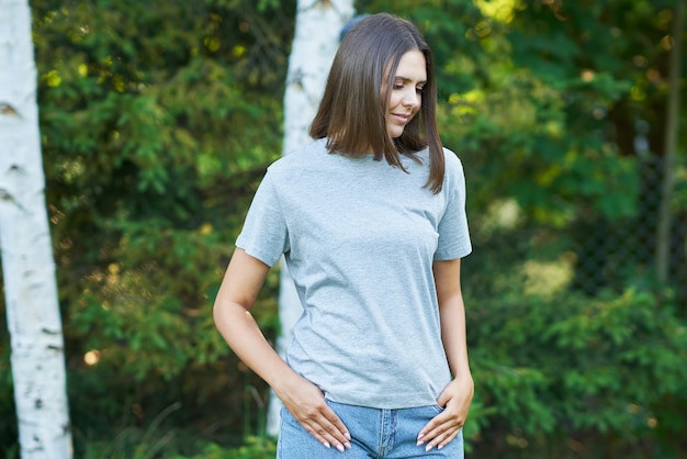 Young woman in gray shirt. High quality photo