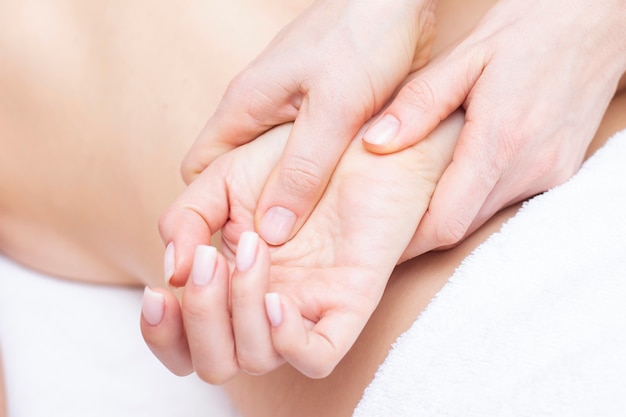 Young woman having arm massage