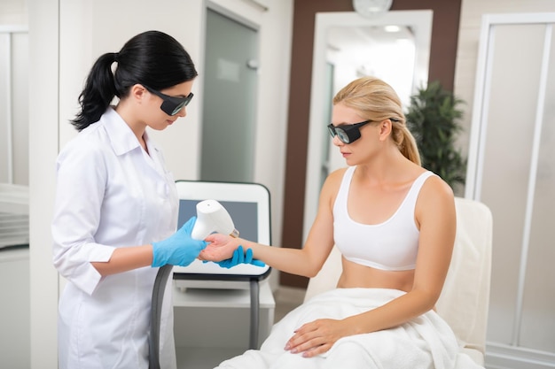 Young woman having her spa procedures in a beauty salon