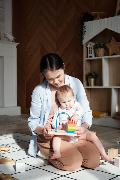 Young woman and her child at home