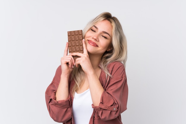 Young woman holding chocolate