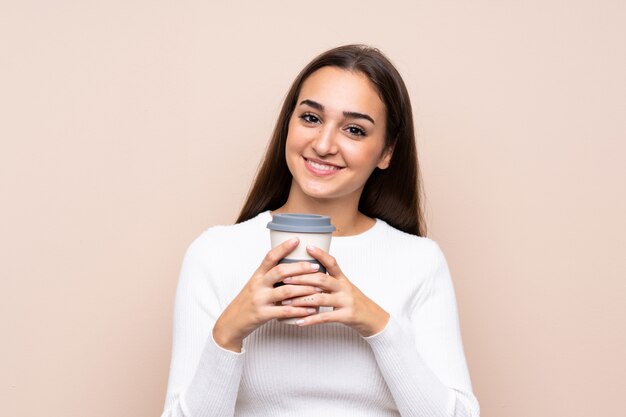 Young woman holding coffee to take away