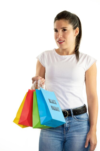 Young woman holding colorful bags on a white background shopping concept sales black friday christmas