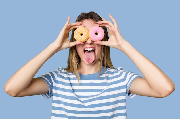 Young woman holding doughnut dessert isolated